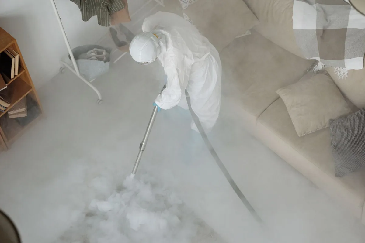 Biohazard cleanup technician in protective equipment, Manistique, MI